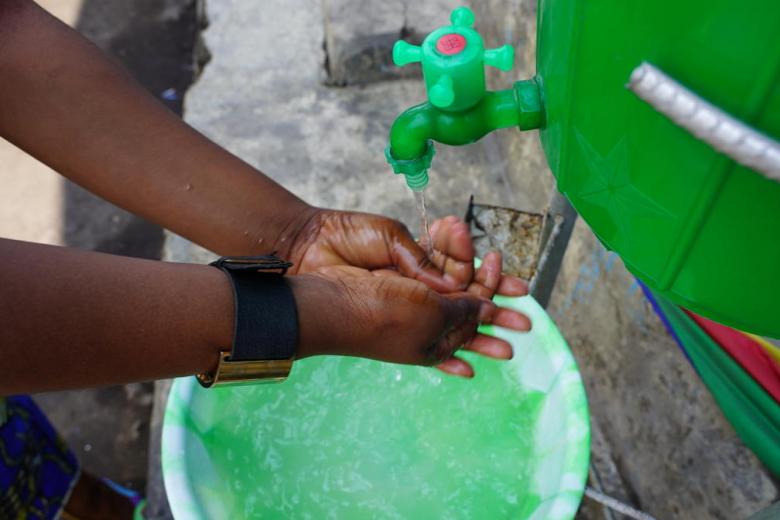 An individual washes their hands