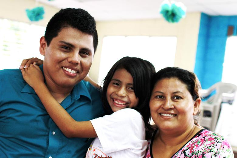 Elisa Gamero and Miguel Artiga with a child in El Salvador