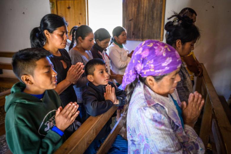 Women and children praying