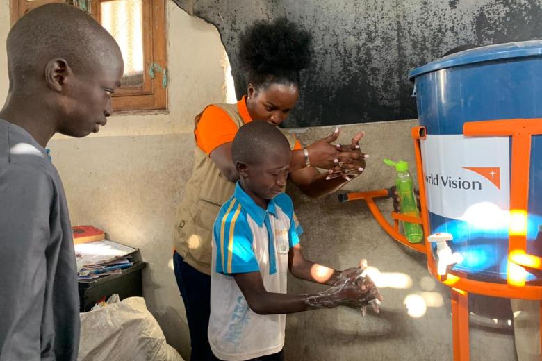 Antoinette Habinshuti, World Vision Senegal National Director doing handwashing lesson with children