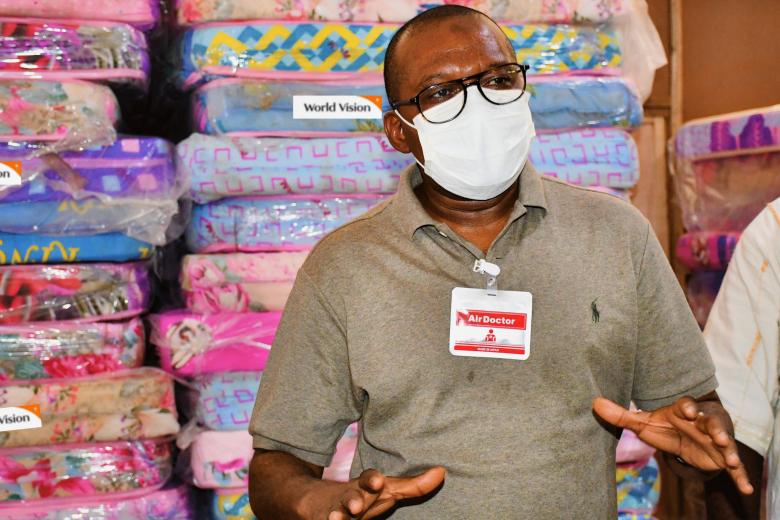 Dr. Mohamed Juldeh Jalloh, Vice President of the Republic of Sierra Leone receiving World Vision's donations to quarantine facilities