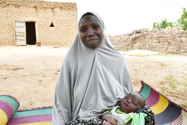 Zeinabou holding her son Imrane