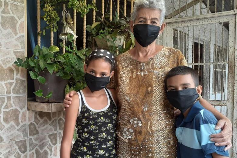 Boy with grandmother and sister.