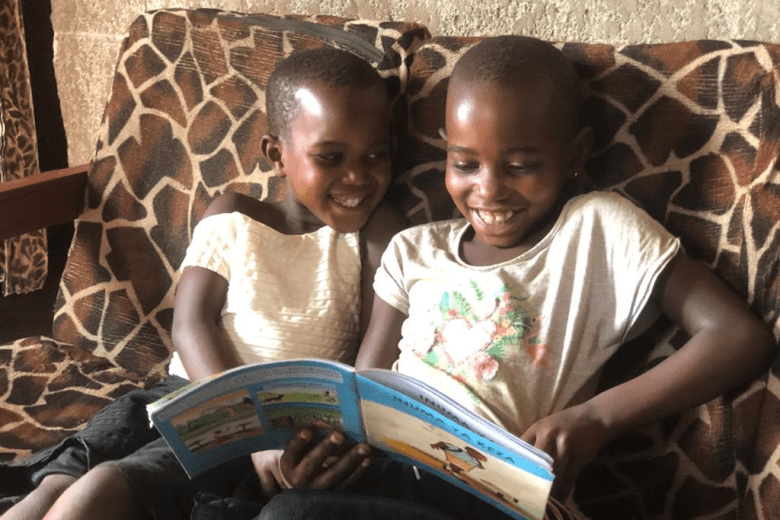 Kellen(right side) and her little sister cheerfully reading