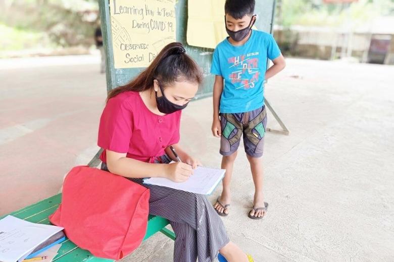 Mae, 18 teaches children in her community in Philippines to read during COVID-19 lockdowns