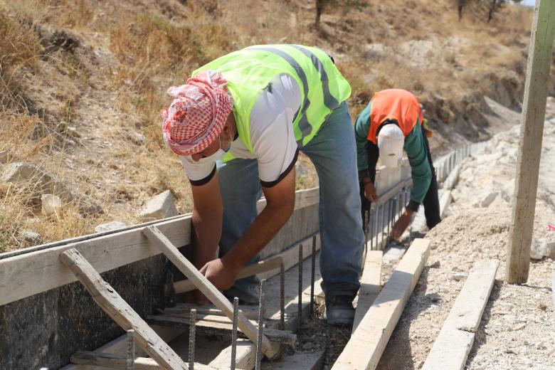 Bassam working
