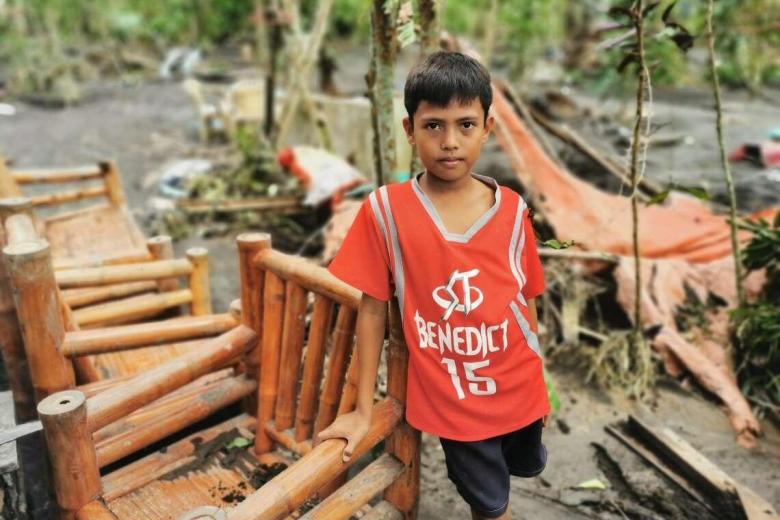 11-year-old Mico's home was buried in mud after Typhoon Goni