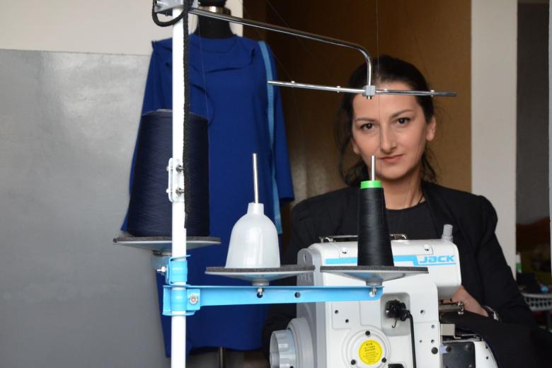 Ana at her small sewing area