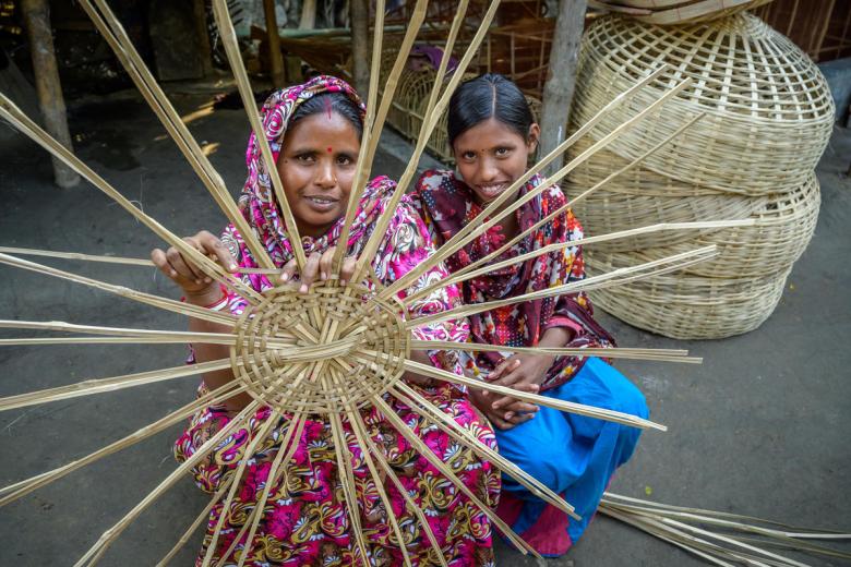 Shabitri and her daughter Ratna at Shabitri's small business