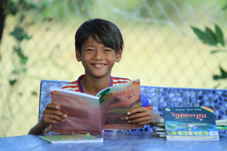 Sponsored child Chamrong loves learning at the reading club.