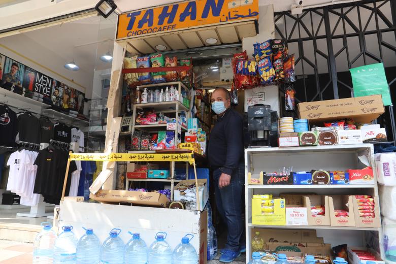 Khalil Tahan standing in front of his small shop