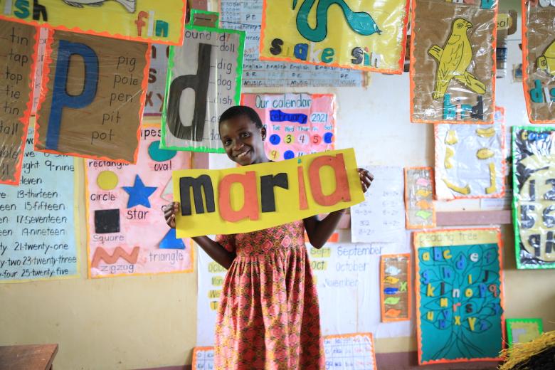 Maria in her print-rich classroom. World Vision supports the initiative of improving the classroom environment to boost learners' experience.