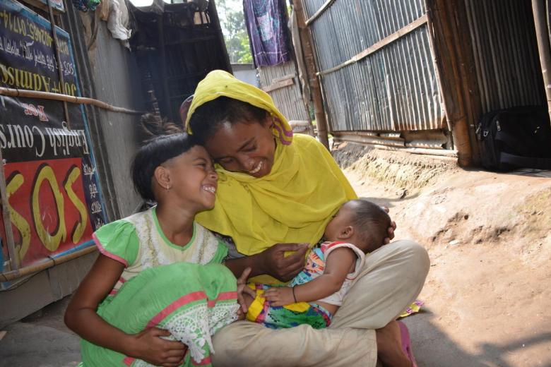 mother breastfeeds her child