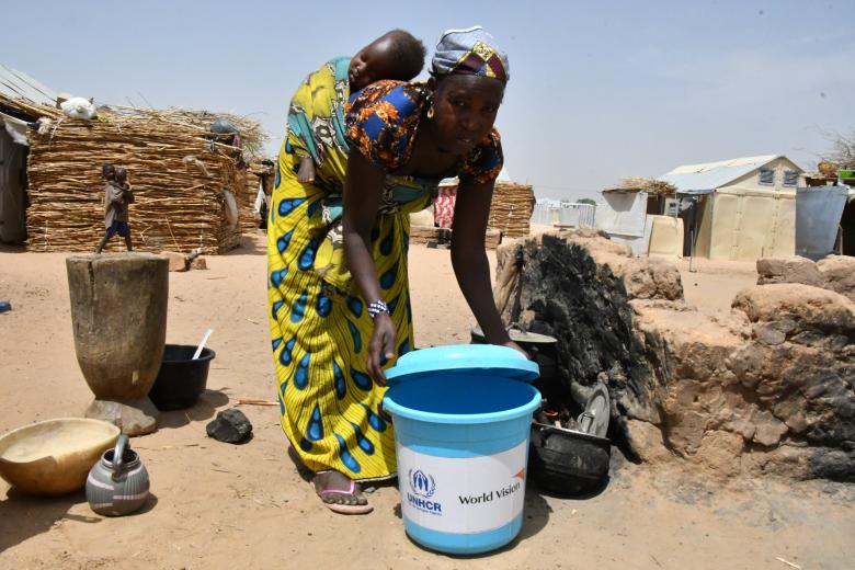 Maria uses the bucket she received for cooking