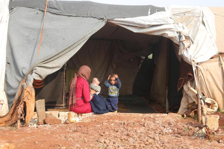 Syrian mother and children in tent
