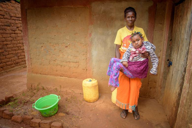 Janet used to have to carry her daughter Cynthia everywhere, until child sponsorship helped her get access to a wheelchair