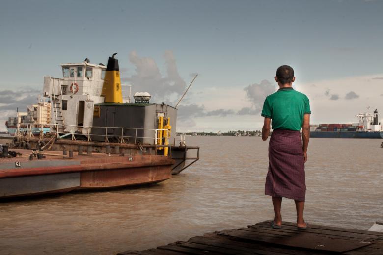 Myanmar man stands on the dock