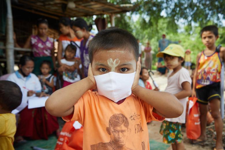 A child in Myanmar wearing a mask