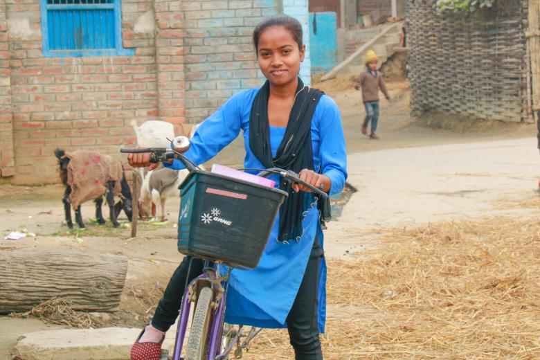 Sunita can now attend school every day on time thanks to her bicycle.