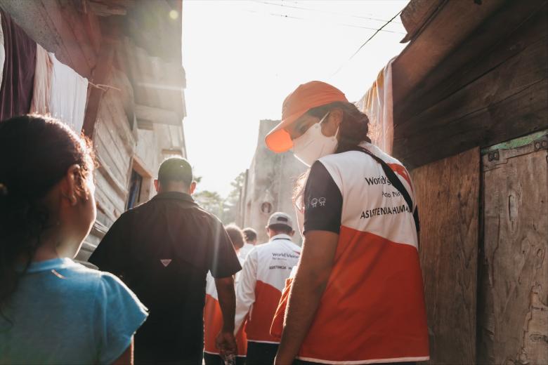 Catherine World Vision staff in Honduras walks and talks with families affected by Hurricane ETA