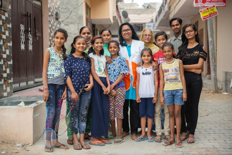 Anitha and the children she helps in her India community.