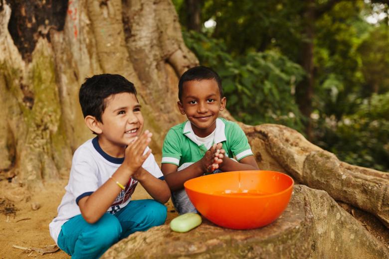 sponsored children wash their hands