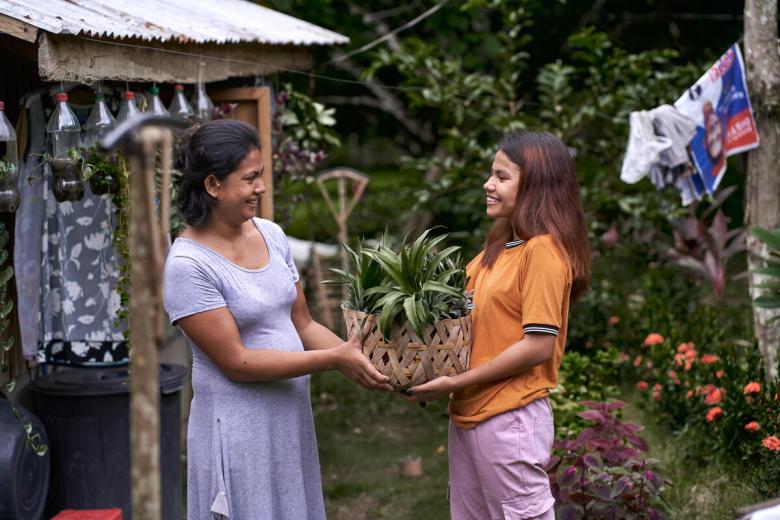 Sponsored child and her family generously share their harvest with neighbours