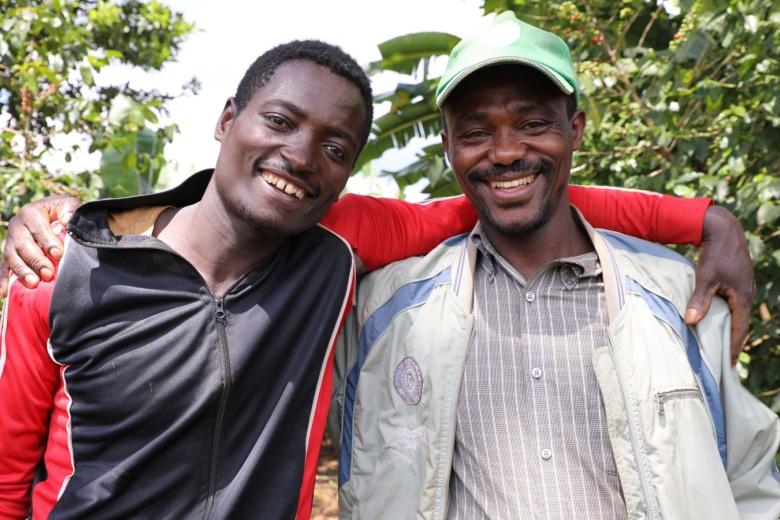Mesfin and Birhanu hugging and smiling