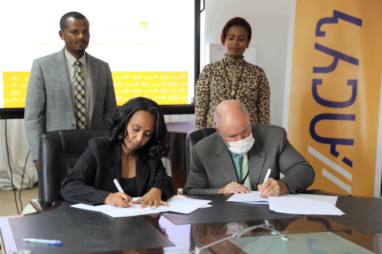 Mr. Edward and Bethelhem signing the MoU