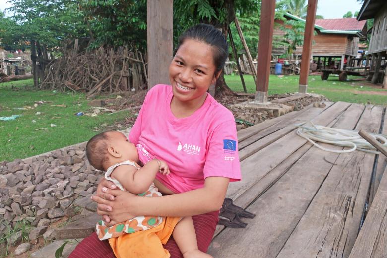 Mother baby breastfeeding Asia smiling