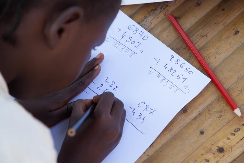 A child works on his maths work