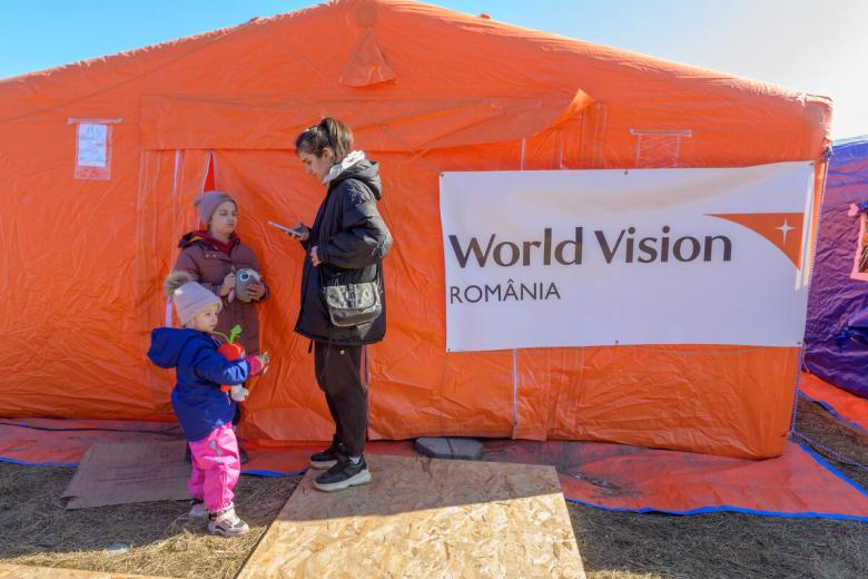 Anna, refugee from Ukraine stands outside a Child Play Space set up by World Vision in Romania
