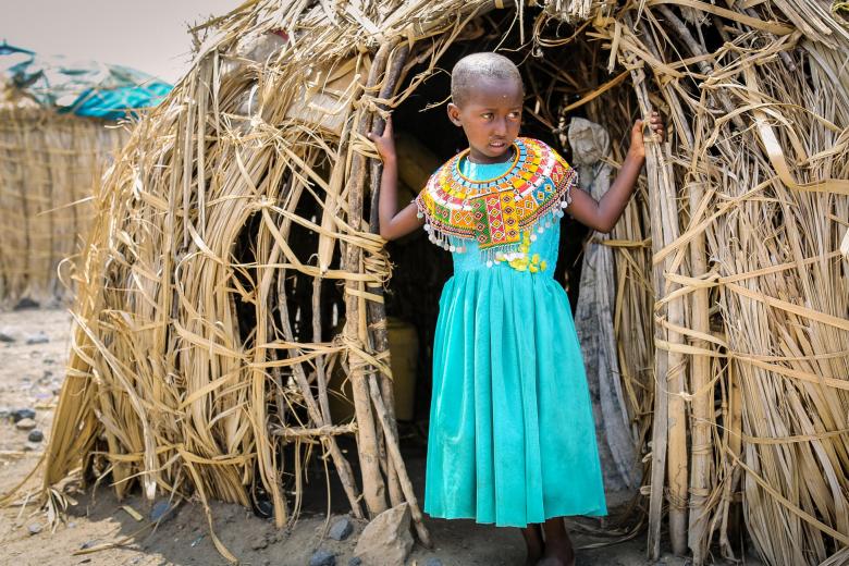 Girls stands outside her home in Marsabit in Kenya