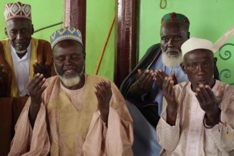 Faith leaders praying