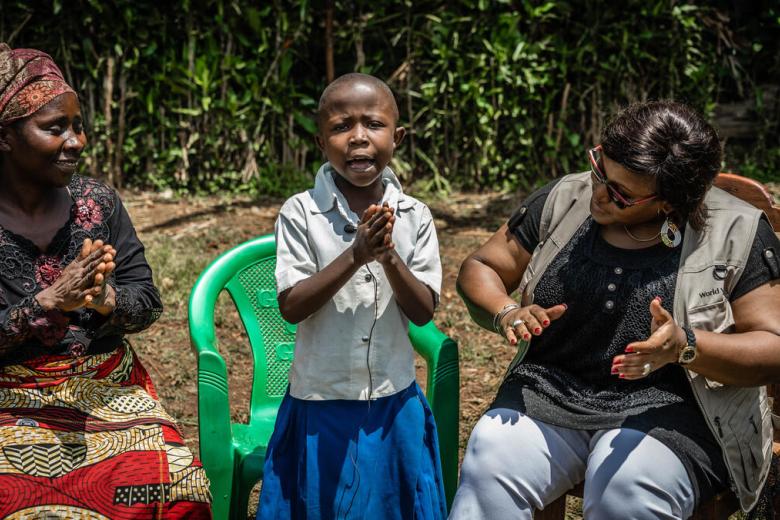 DRC Child whose mum benefited from savings group singing