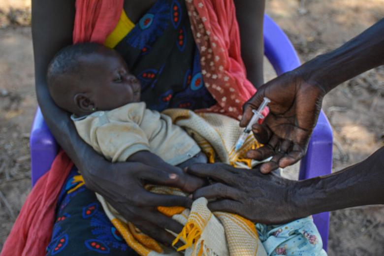 Child getting an injection against polio in South Sudan