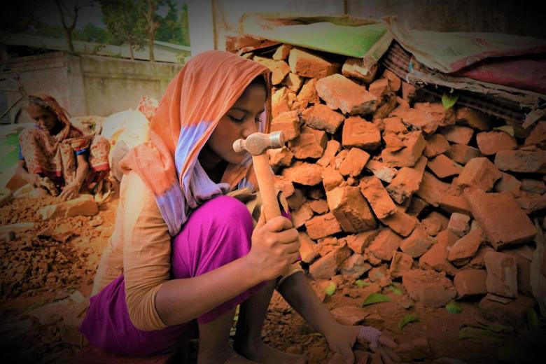 Child labourer Nuri in Bangladesh breaks bricks to earn money for her family.