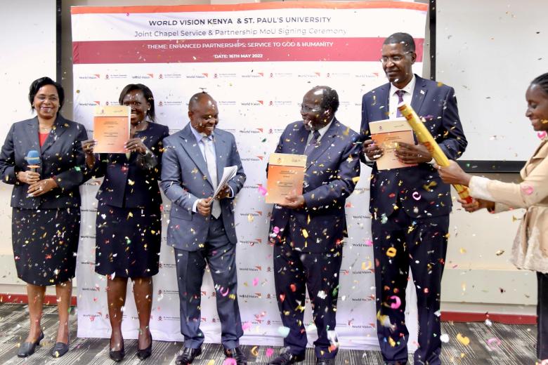 The World Vision Kenya senior leadership team with the St Paul's University Chancellor and Vice Chancellor celebrating the partnership.JPG