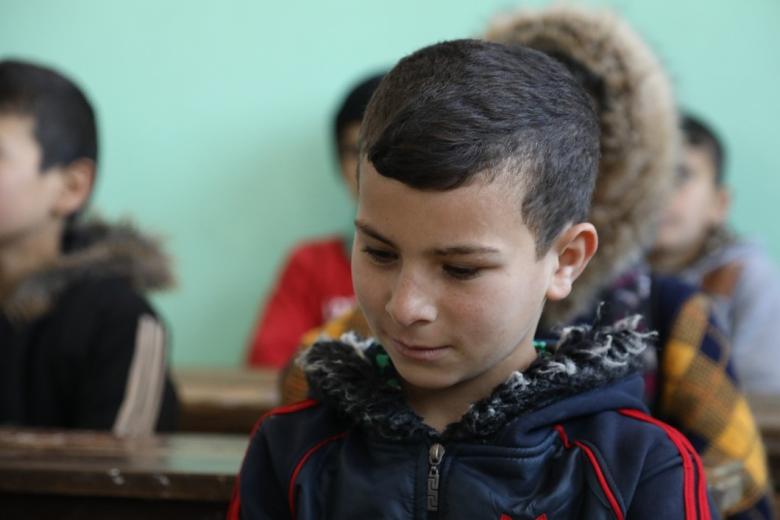 Amir at school in Syria refugee camp