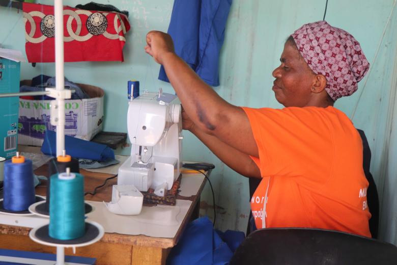 EMATHEKU SEWING MACHINE MAKING SURE THAT NO CHILD FROM MGAMUDZE COMMUNITY WEARS TORN UNIFORM