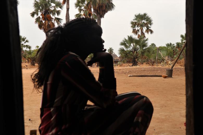 Young lady from South Sudan in deep thoughts.