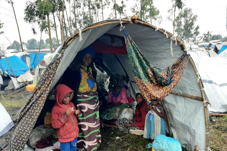 A displaced family in their shelter at Kanyaruchinya camp