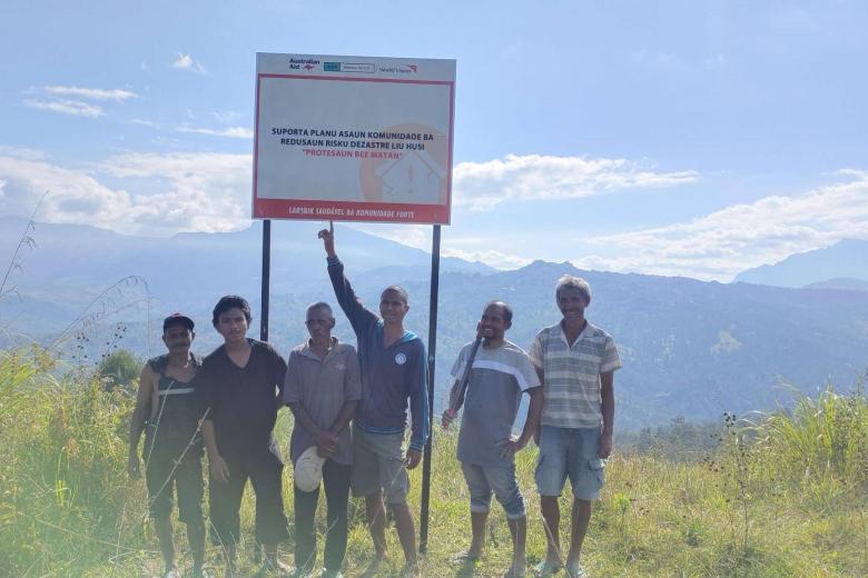 Marques and friends with Water Spring Protection project sign-Bobonaro Timor-Leste