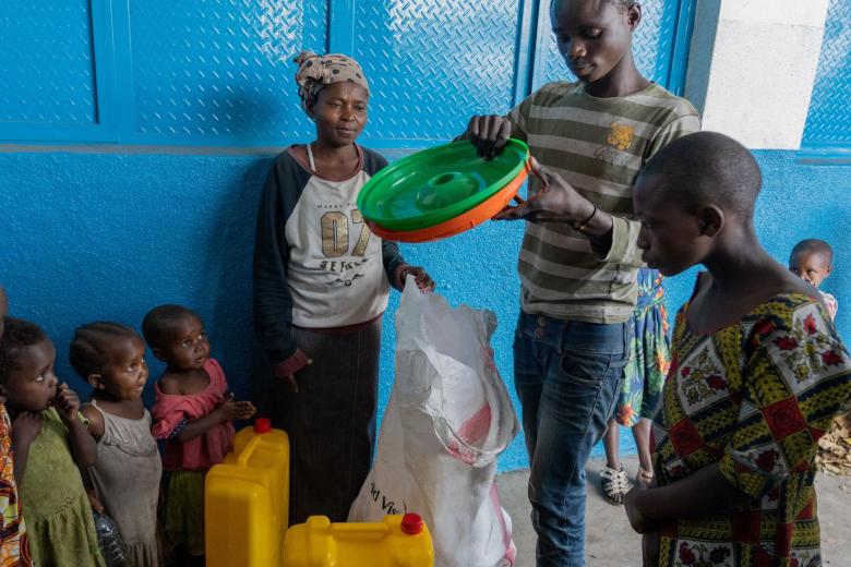 Germaine with her family after receiving a Wash kit