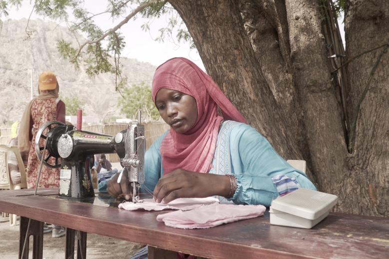 Woman making reusable sanitary towels