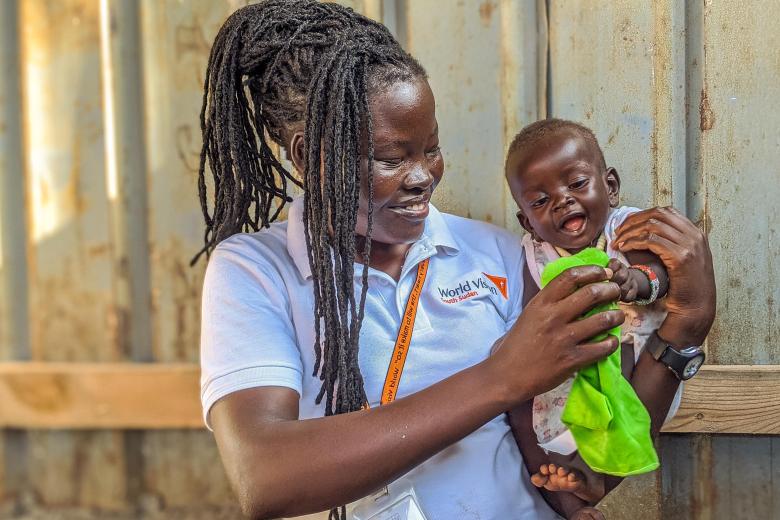 WV South Sudan Ajio Bridget holding a baby