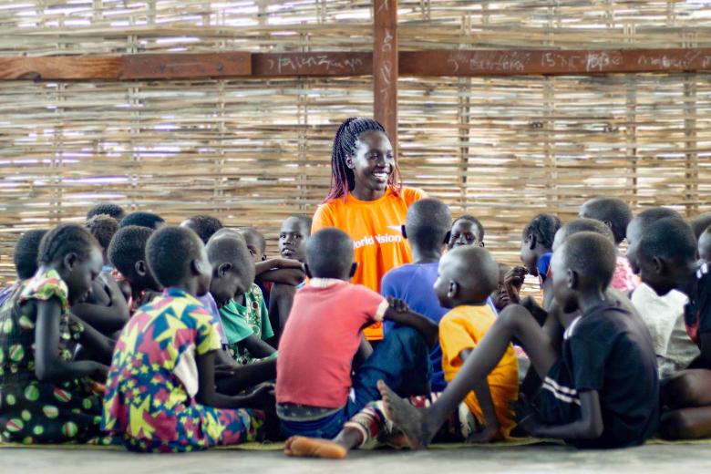 Woman in South Sudan surrounded by children