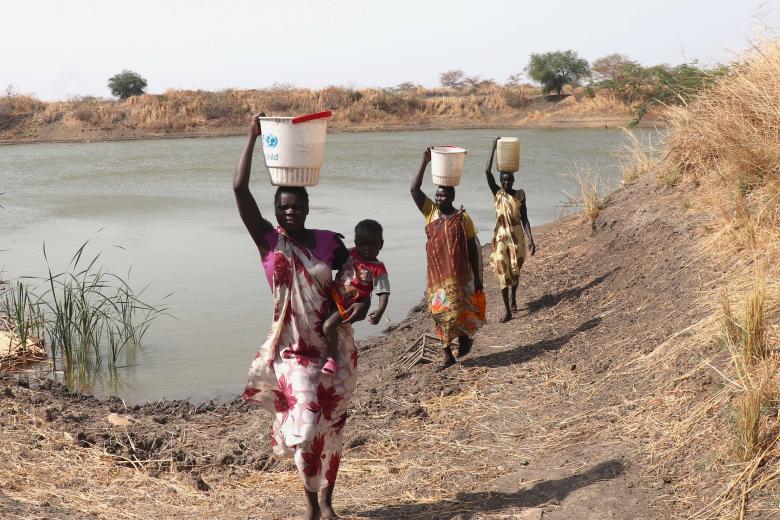 Group of women fetchng water