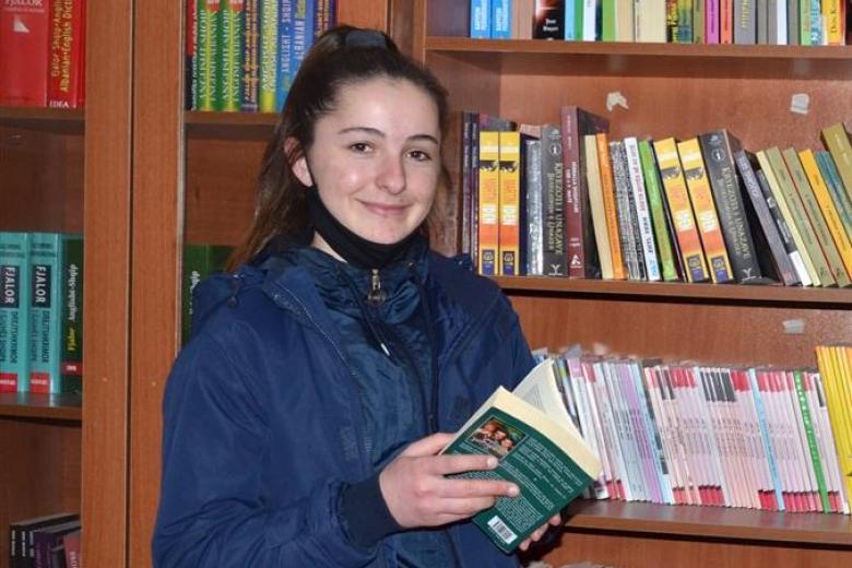 Mirjeta reading a book
