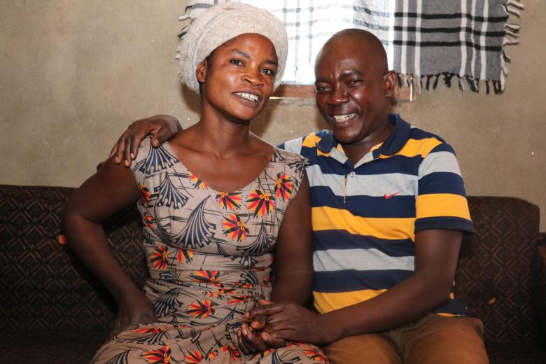 Burafiki with his wife in their house